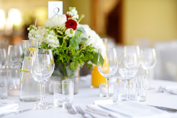 Beautiful table setting with crockery and flowers for a party, wedding reception or other festive event