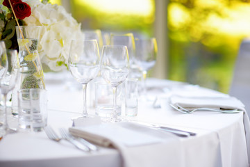 Beautiful table setting with crockery and flowers for a party, wedding reception or other festive event