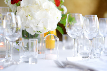 Beautiful table setting with crockery and flowers for a party, wedding reception or other festive event