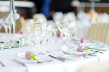 Beautiful table setting with crockery and flowers for a party, wedding reception or other festive event