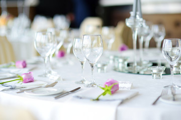 Beautiful table setting with crockery and flowers for a party, wedding reception or other festive event
