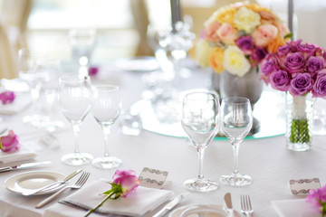 Beautiful table setting with crockery and flowers for a party, wedding reception or other festive event