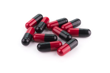 Black and red capsule pills