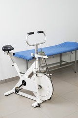 Fototapeta na wymiar Exercise Bike And Bed In Hospital
