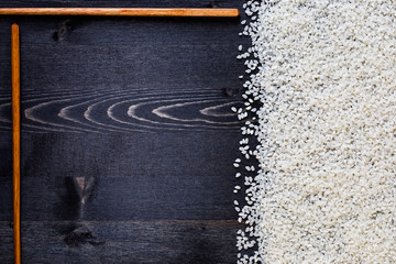 sushi rice on dark table, space for text