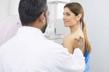Doctor Preparing Patient For Mammogram Test