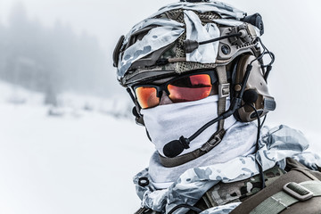 Winter arctic mountains warfare. Action in cold conditions. Trooper with weapons in forest somewhere above the Arctic Circle © Getmilitaryphotos