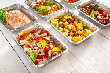 Healthy food take away, top view at wood background