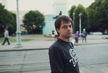 lovely  guy waiting impatiently for the train