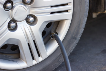 Rubber Hose  Fill tire Filling air into a car tire to increase pressure