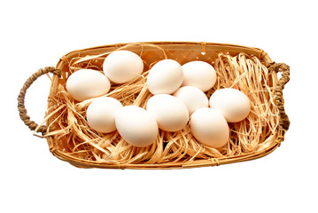Fresh Hen Eggs in a Basket Isolated Over White