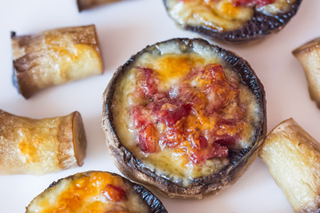 Baked mushroom caps stuffed with salami, prosciutto, garlic, butter and herbs