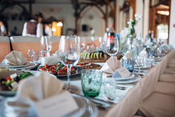 The dishes,bottles and plates stand on the table
