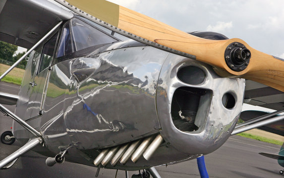 Chrome body aircraft and wooden propallor. Oldtimer. Vintage. Airshow. Airport. Antique aircraft with wooden propellors. Aviation. Airplane
