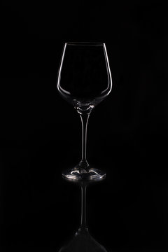 Empty wine glass. Isolated on black background