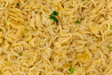 Instant noodles as background.