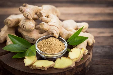 Foto op Aluminium Ginger root and ginger powder in the bowl © pilipphoto