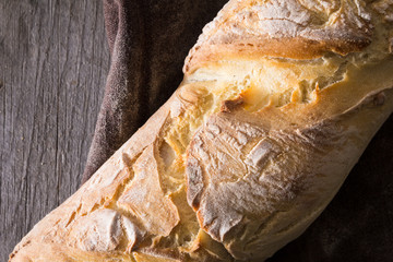 Homemade baguettes on wooden table