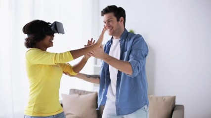 happy couple with virtual reality headset at home - Powered by Adobe
