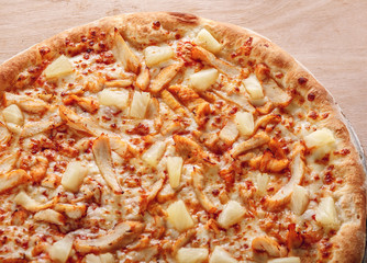 pizza with chicken, mozzarella, olives and basil top view with copy space