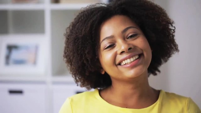 happy african american young woman face at home