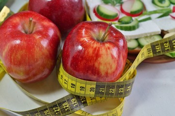 Diet - slimming .Weight loss concept with red apple, vegetables and dairy products
