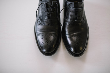 beautiful black leather and lacquered shoes for the groom