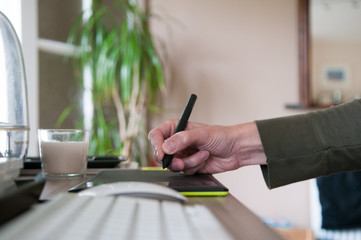 Fototapeta premium Graphic designer using a drawing graphics tablet