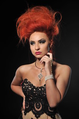 Naklejka premium red hair girl model at the black background