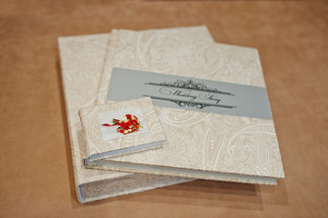 Elegant wedding album and photo book from beige material.