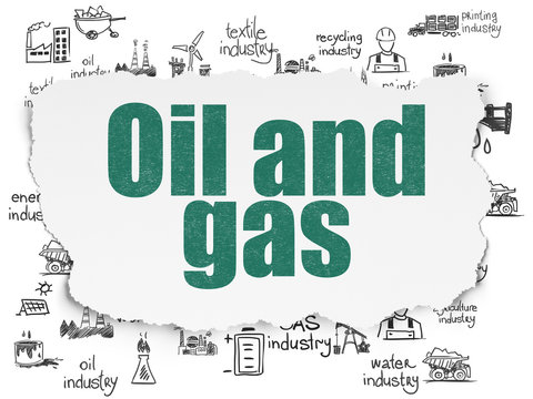 Manufacuring concept: Oil and Gas on Torn Paper background