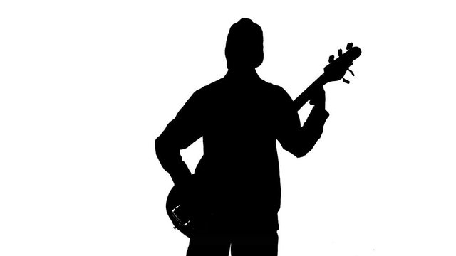 Silhouette of musician with bass guitar