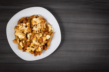 Poutine quebec meal with french fries, gravy and cheese curds
