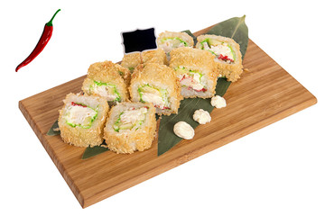 Sushi rolls on wooden Board with leaves of leeks and black sign for logo and name
