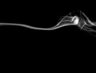 Smoke. White smoke swirls over black background. Abstract smoke on black background