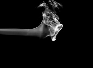 Smoke. White smoke swirls over black background. Abstract smoke on black background