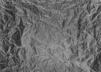 Crumpled paper background vignette.