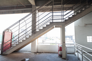 stair on building and red door