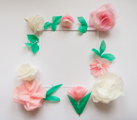 square frame with color paper flowers. Flat lay. Nature concept