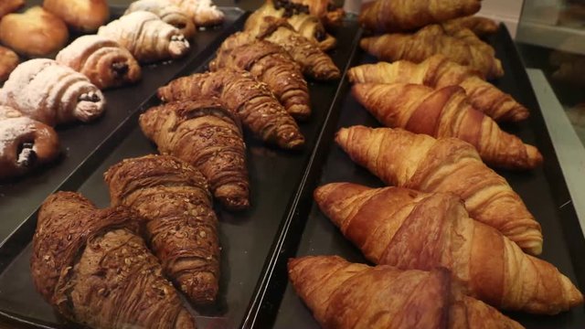 Croissants and sugar carbs on display at bakery