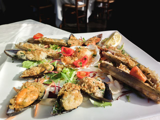 Hot and cold snacks from barnacles, fish and shrimp. Mediterranean cuisine.