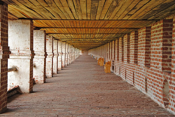 corridor monastery wall of old red bricks