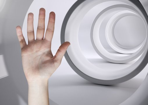 Composite image of open hand against futuristic tunnel