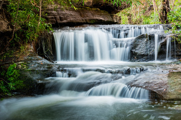 Fototapeta na wymiar beautiful small waterfalls and plants of Sang Chan Waterfall in Ubon Ratchathani, Thailand