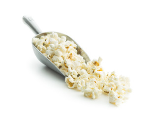 Tasty popcorn in metal scoop.