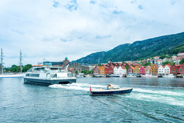Naklejka premium Bryggen street with boats in Bergen, Norway