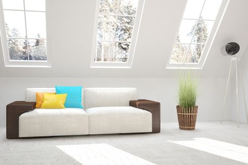 White room with sofa and winter landscape in window. Scandinavian interior design