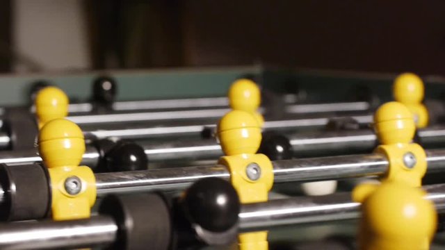 Table soccer close-up - black and yellow figures - no people