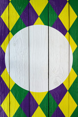Diamond green, purple, yellow pattern painted Mardi Gras holiday background. Empty space for copy,...