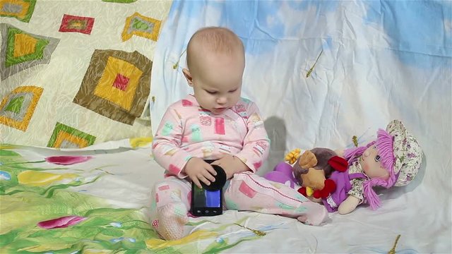 Baby playing with a smartphone